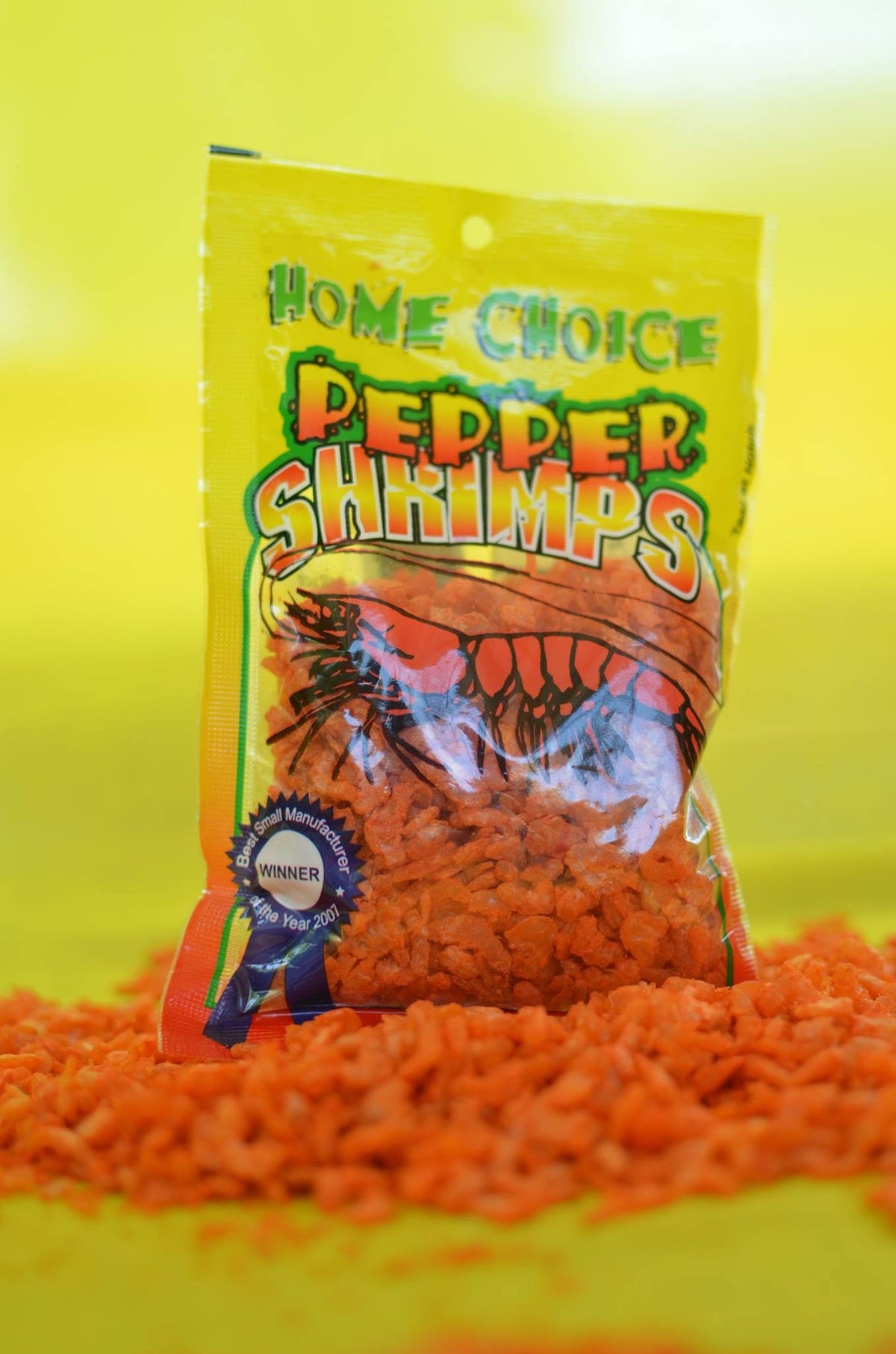Home Choice Pepper Shrimps authentic Jamaican spicy pepper shrimp snack in original packaging.