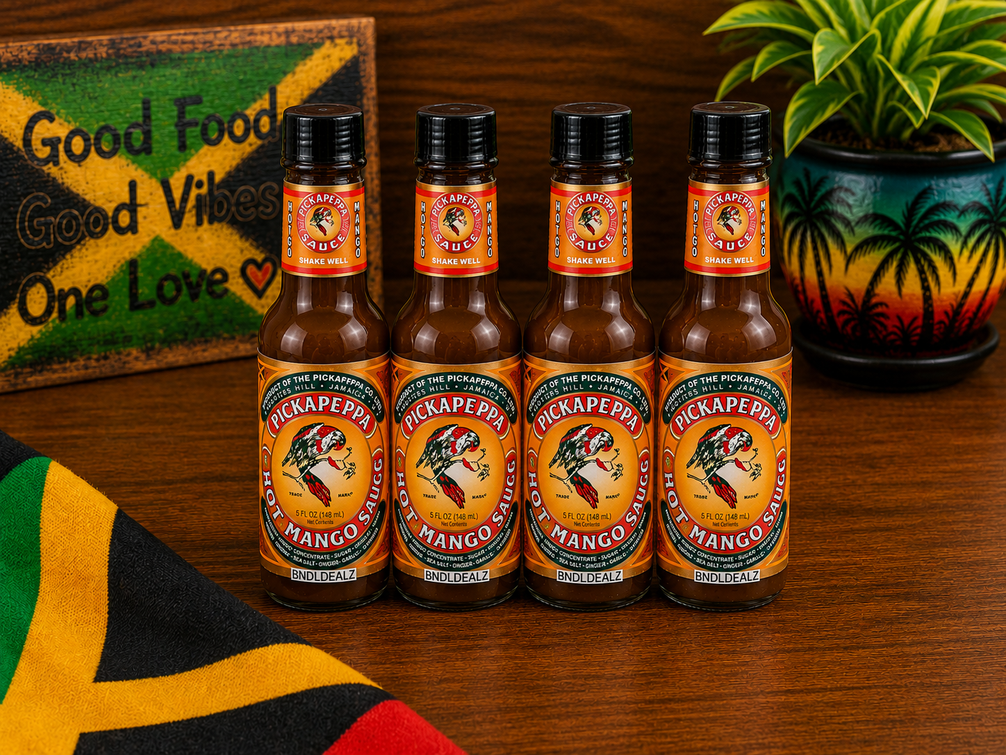 Pickapeppa Sauce Hot Mango 4-pack professionally bundled by BNDLDEALZ in a Jamaican-inspired kitchen setting.