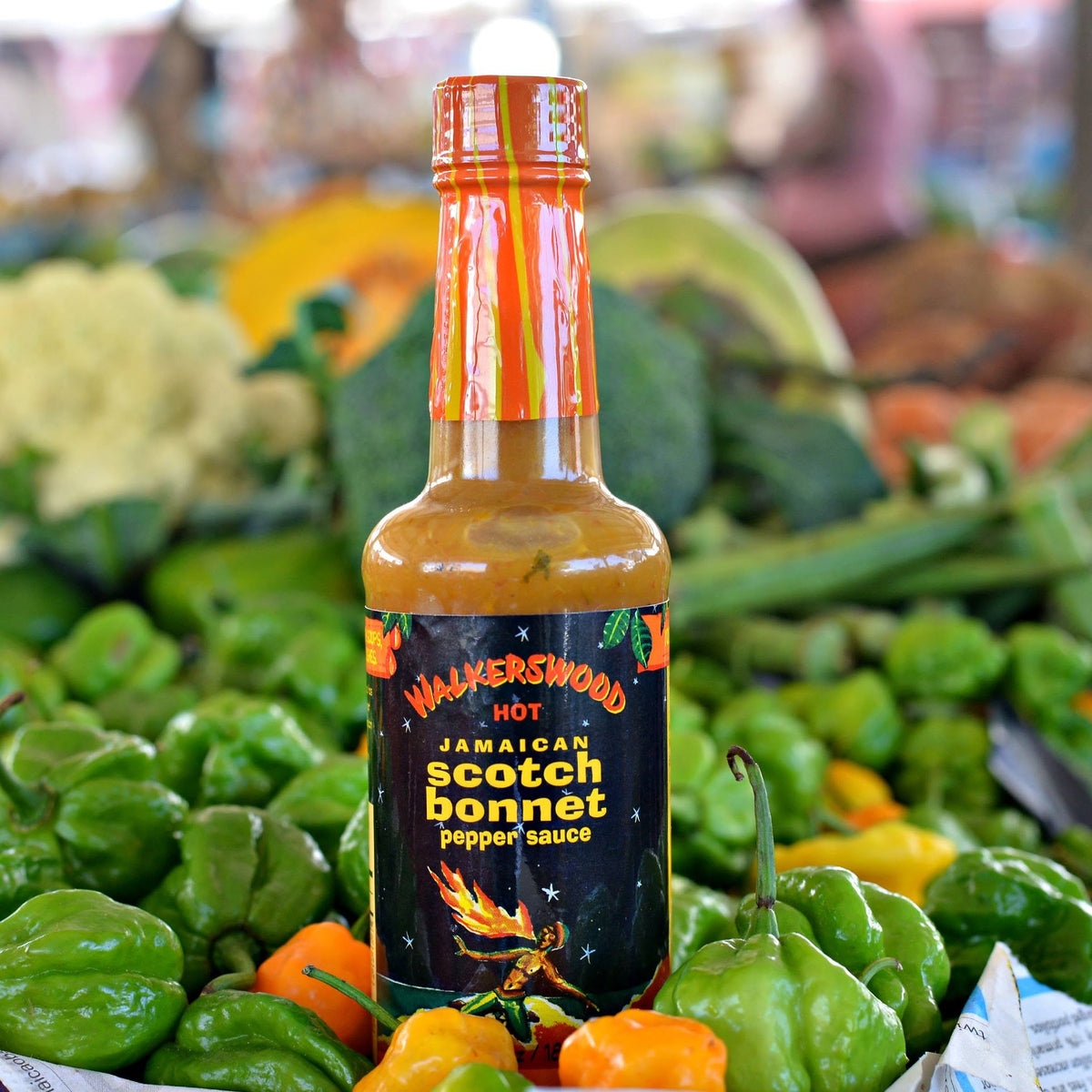 Walkerswood Jamaican Scotch Bonnet Pepper Sauce with fresh hot peppers