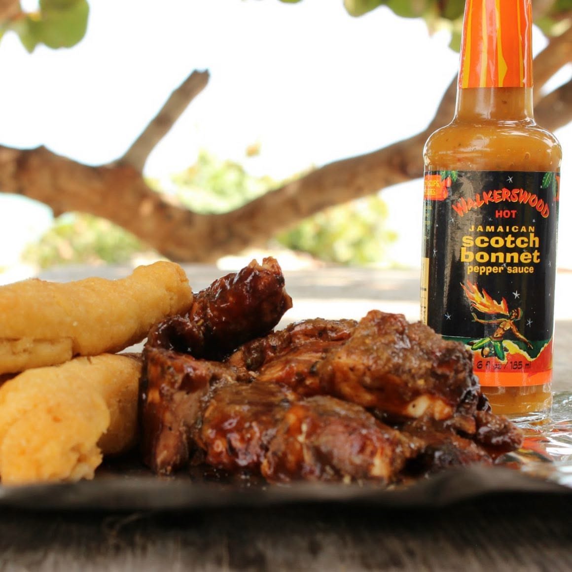 Walkerswood Scotch Bonnet Pepper Sauce with Jamaican grilled meat
